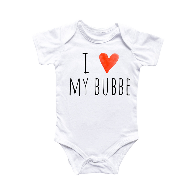 a white baby bodysuit with a red heart on it