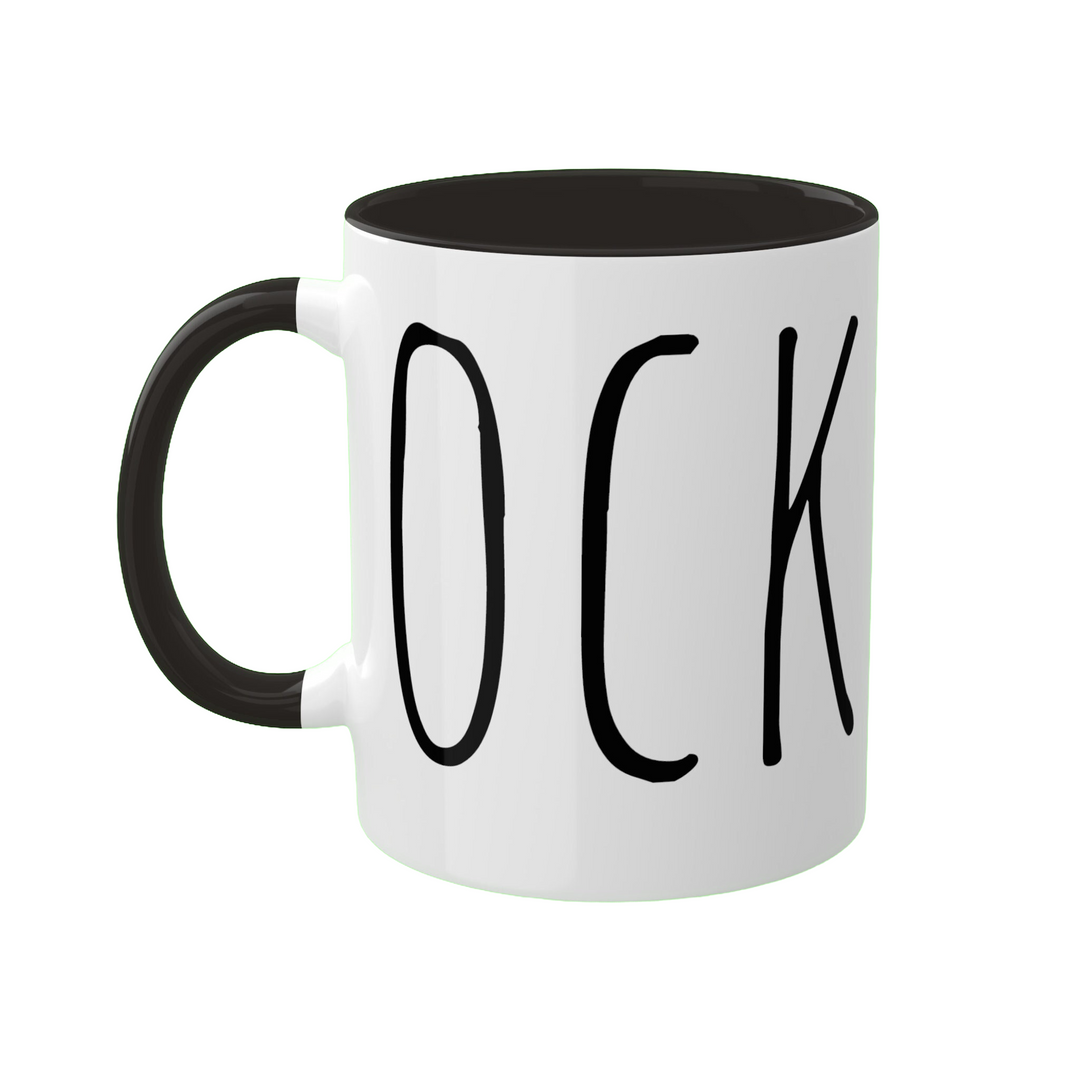 a black and white coffee mug with the word cock on it