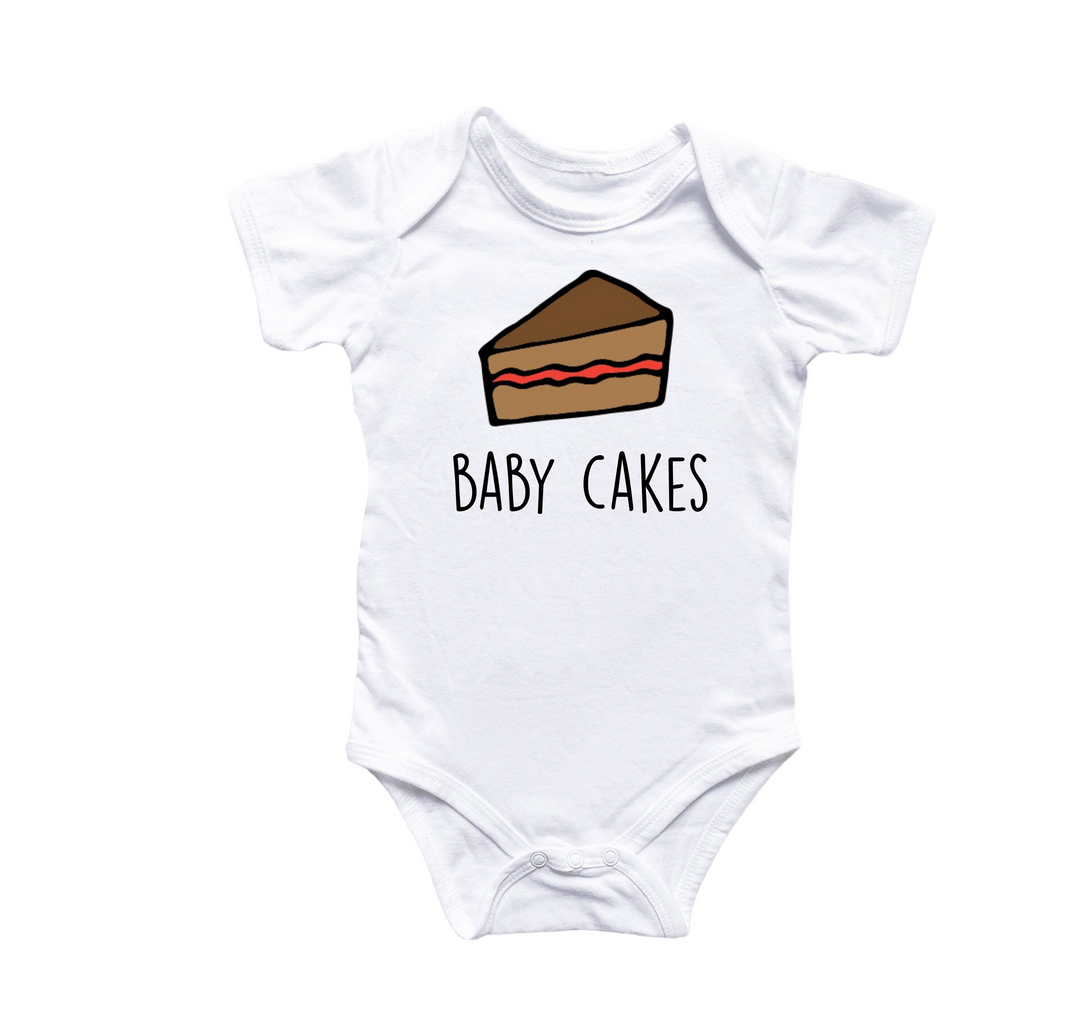 a baby bodysuit with a piece of cake on it