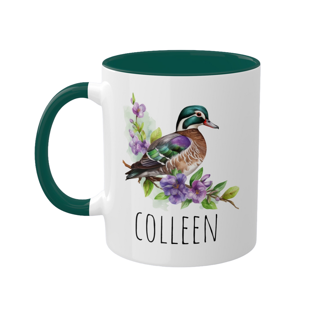 a white and green coffee mug with a bird on it