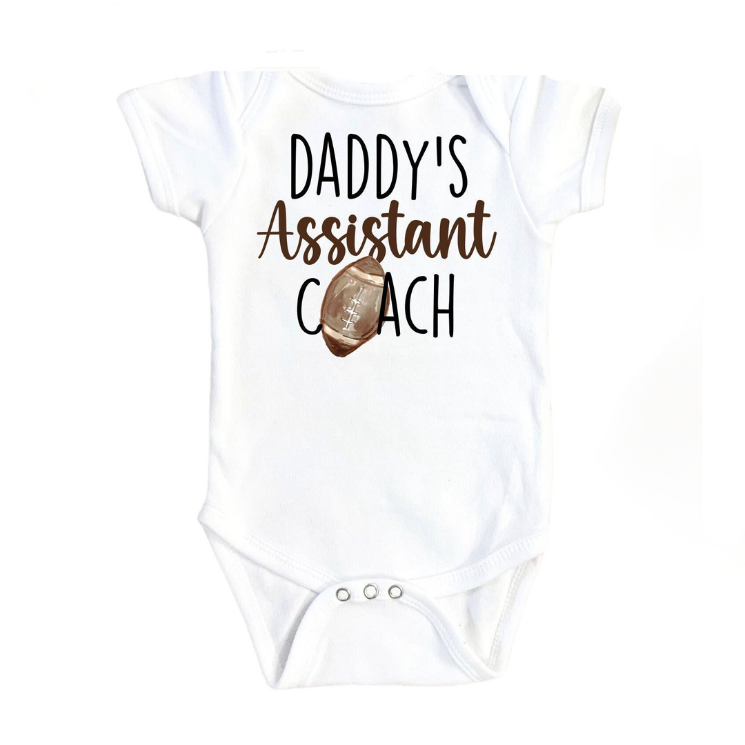 a white bodysuit with the words daddy's assistant coach on it