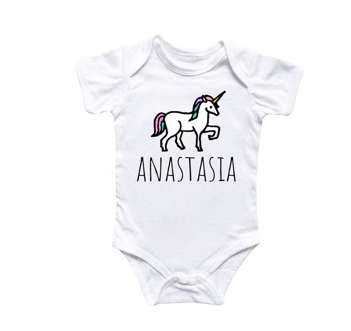 a white baby bodysuit with an image of a unicorn