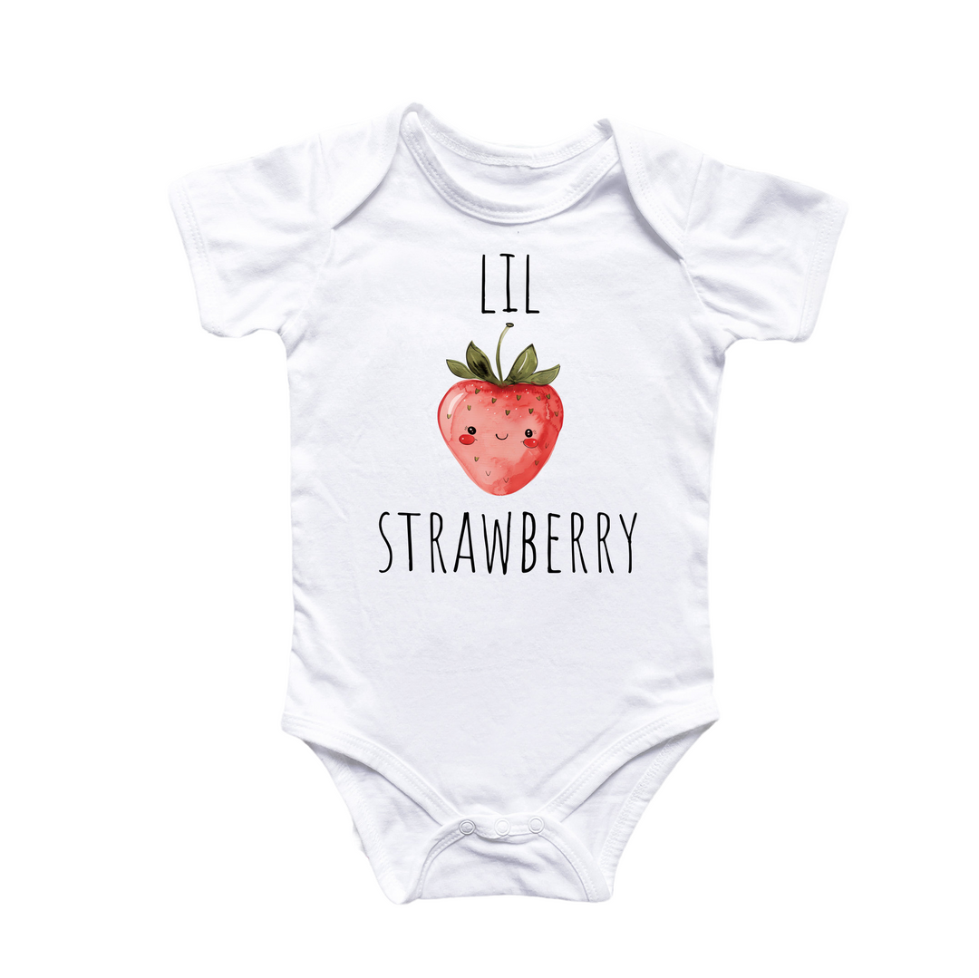 a white bodysuit with a strawberry on it