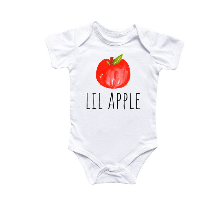 a white bodysuit with a red apple on it