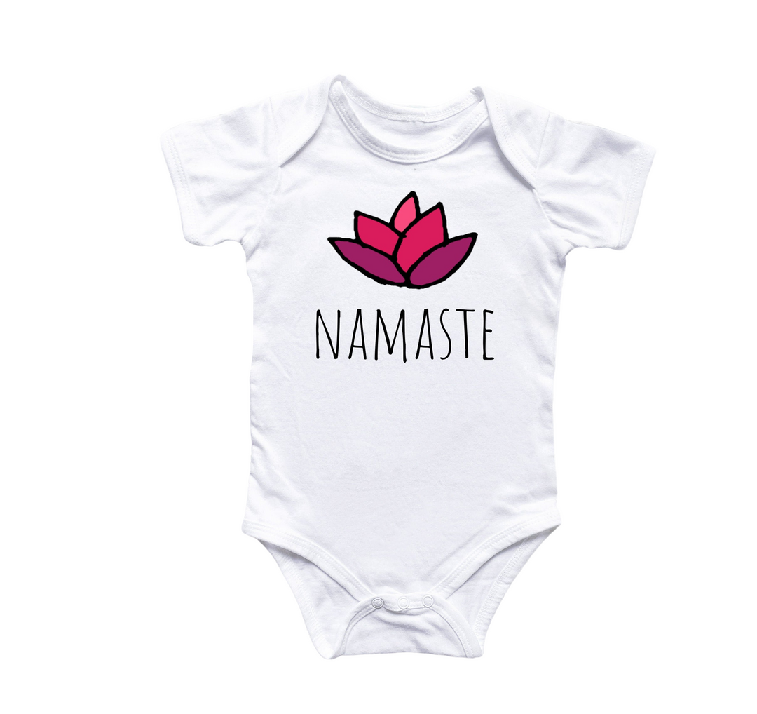 a white bodysuit with the words namaste printed on it