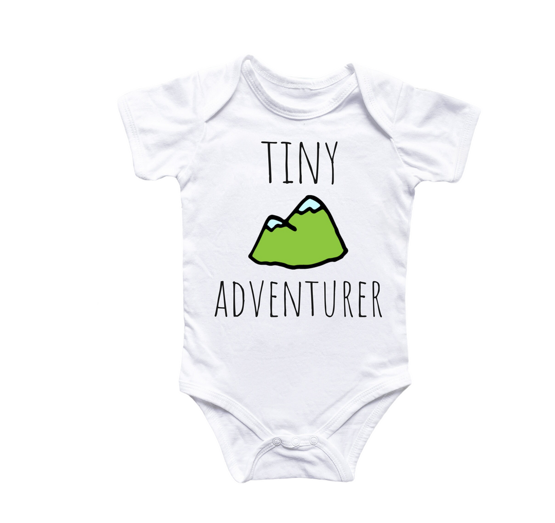 a white bodysuit with a green mountain on it