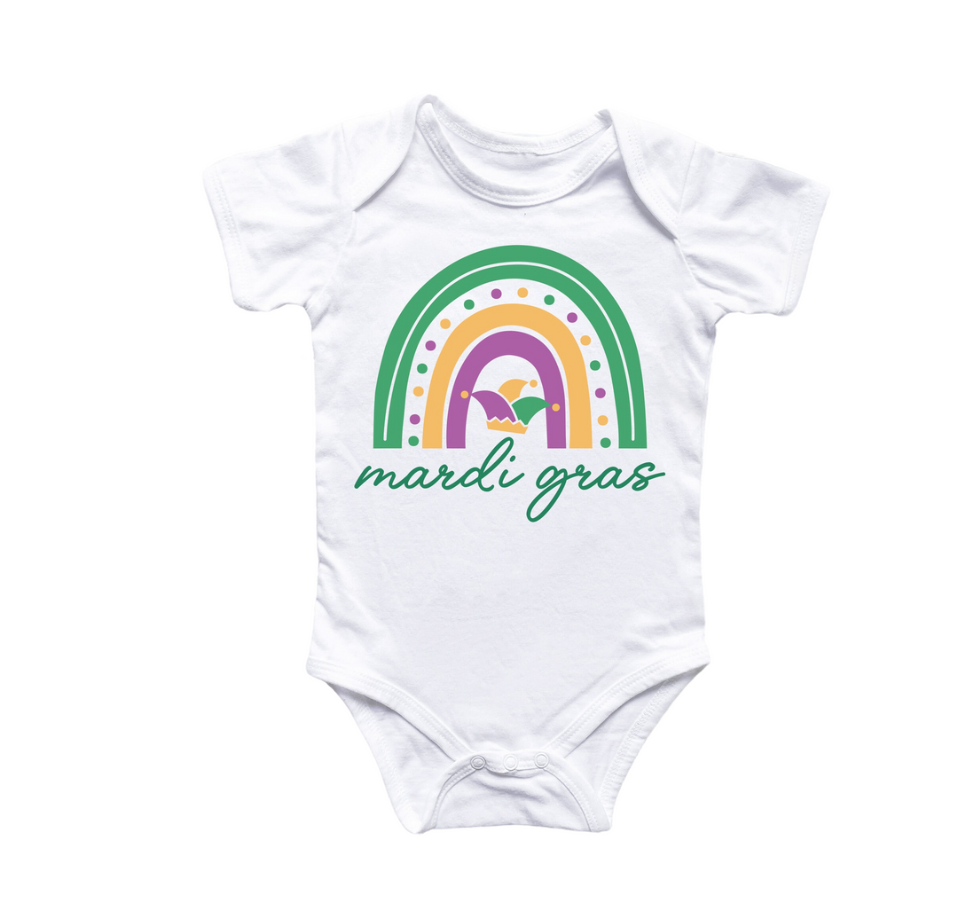 a white bodysuit with a rainbow and the words made in grass