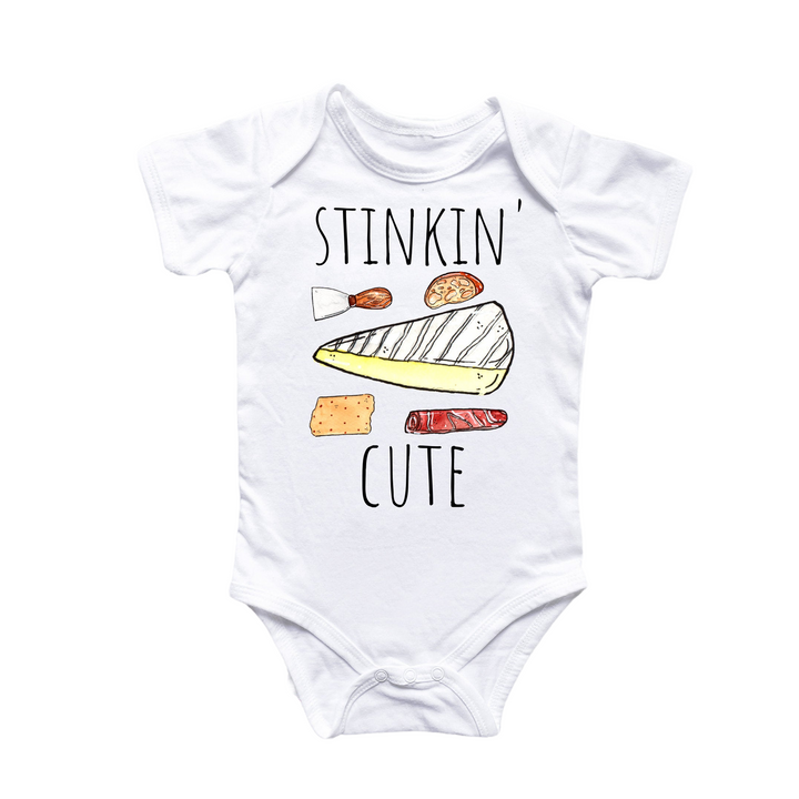 a white bodysuit with the words stinkkin'cute on it