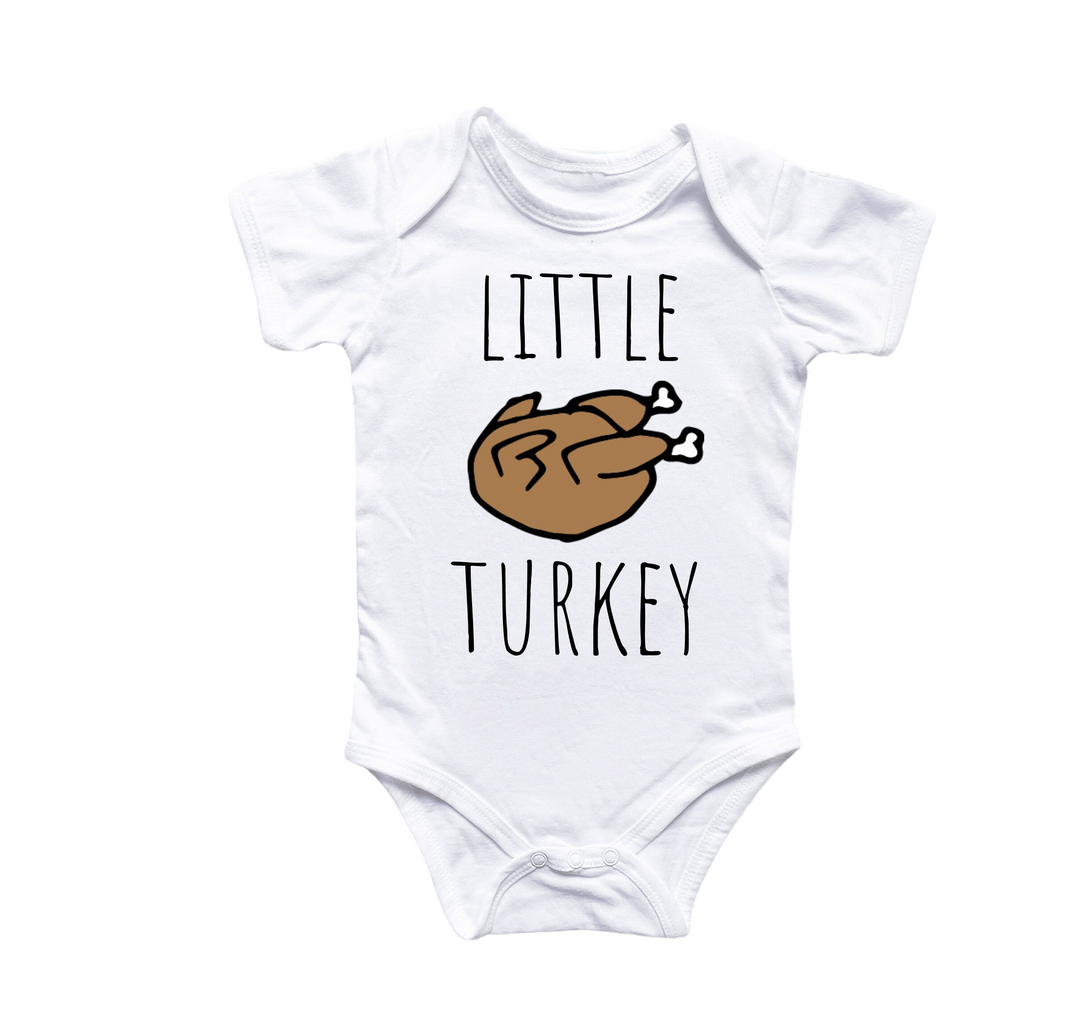 a white baby bodysuit with a turkey on it