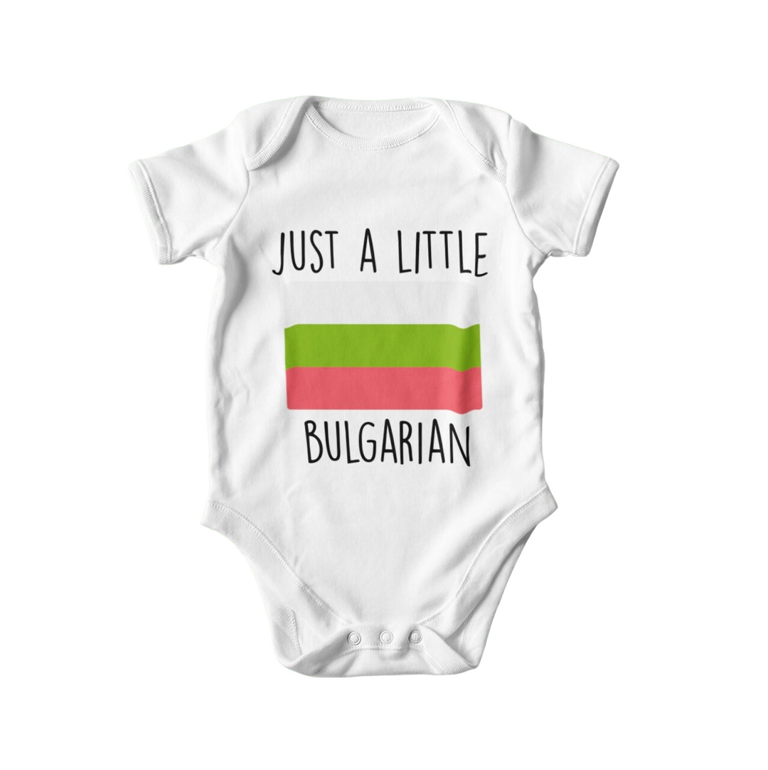 a baby bodysuit with the words just a little hungarian on it