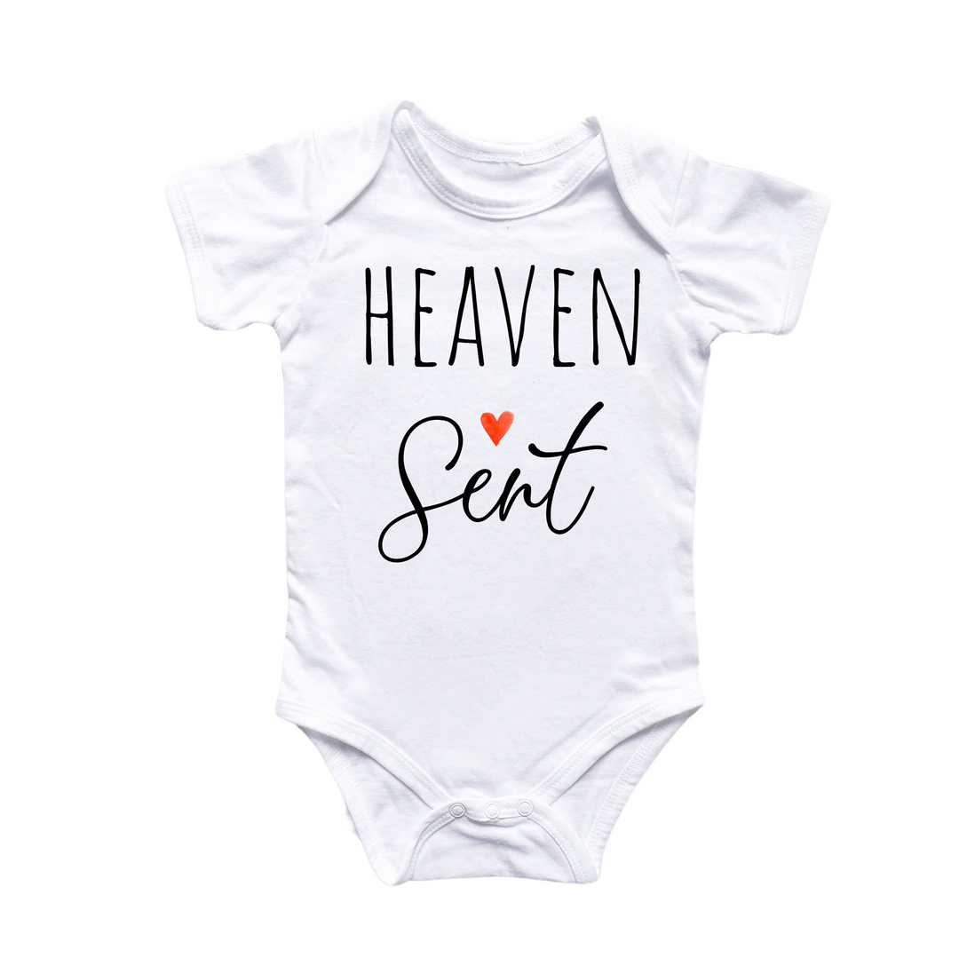 a white bodysuit with the words heaven seat printed on it