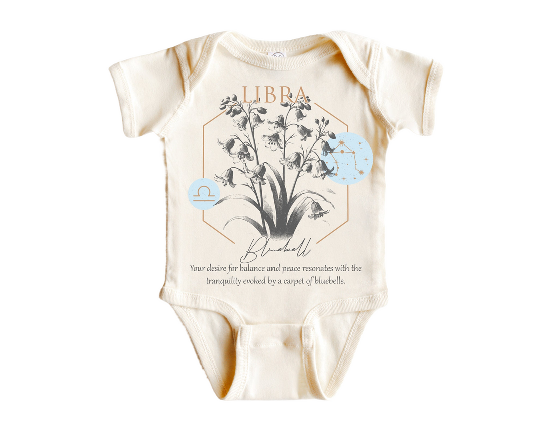 a baby bodysuit with a picture of a plant on it