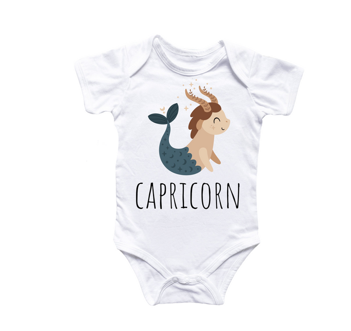 a white bodysuit with a cartoon of a mermaid and the words capricorn