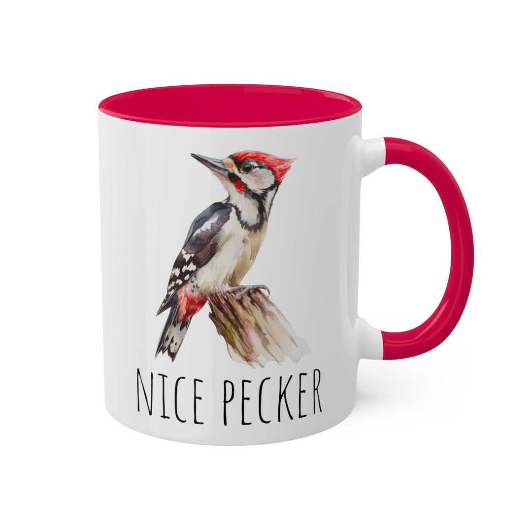 a red and white coffee mug with a bird on it