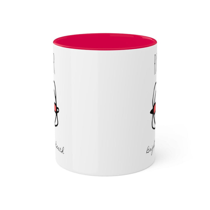 a white coffee mug with a red rim