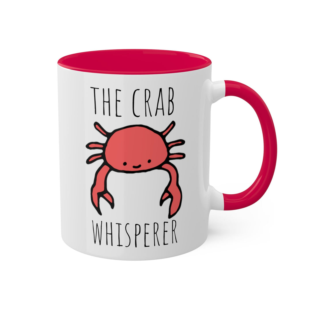 a red and white coffee mug with a crab on it