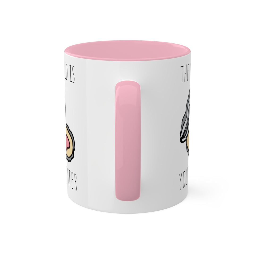 a white and pink coffee mug with a pink handle