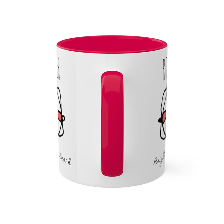a white and red coffee mug with a red handle