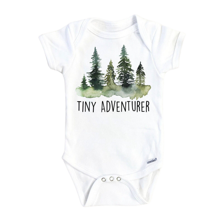 a white bodysuit with trees on it that says tiny adventurer