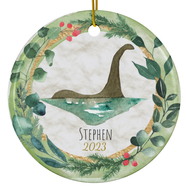 a ceramic ornament with a watercolor painting of a bird