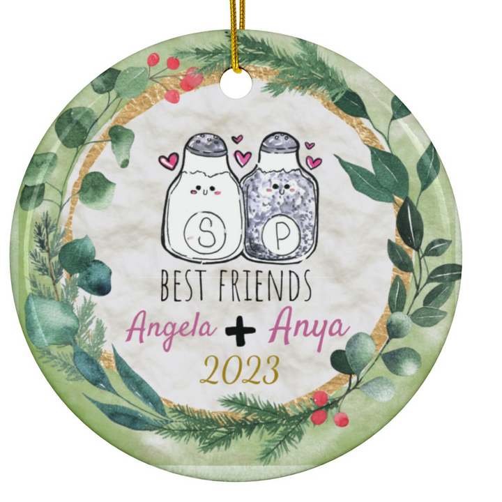 a christmas ornament with two cats on it