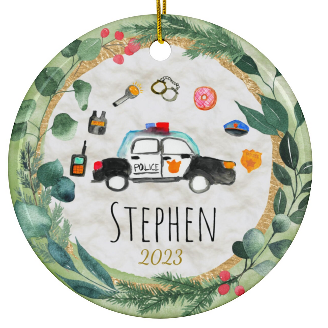 a personalized ornament with a police car on it