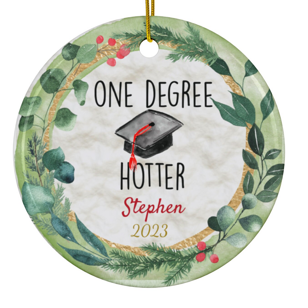 a ceramic ornament with a graduation cap on it