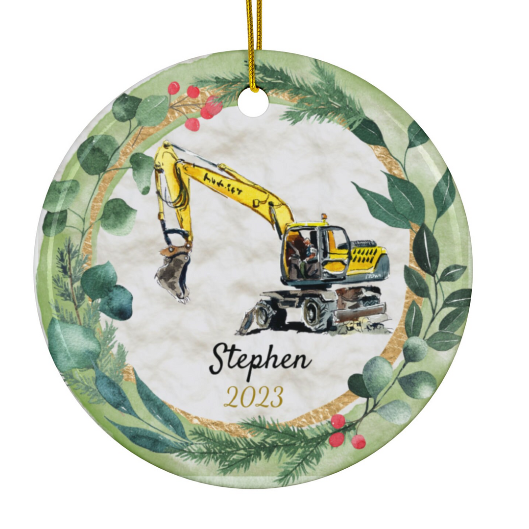 a personalized ornament with a construction vehicle on it