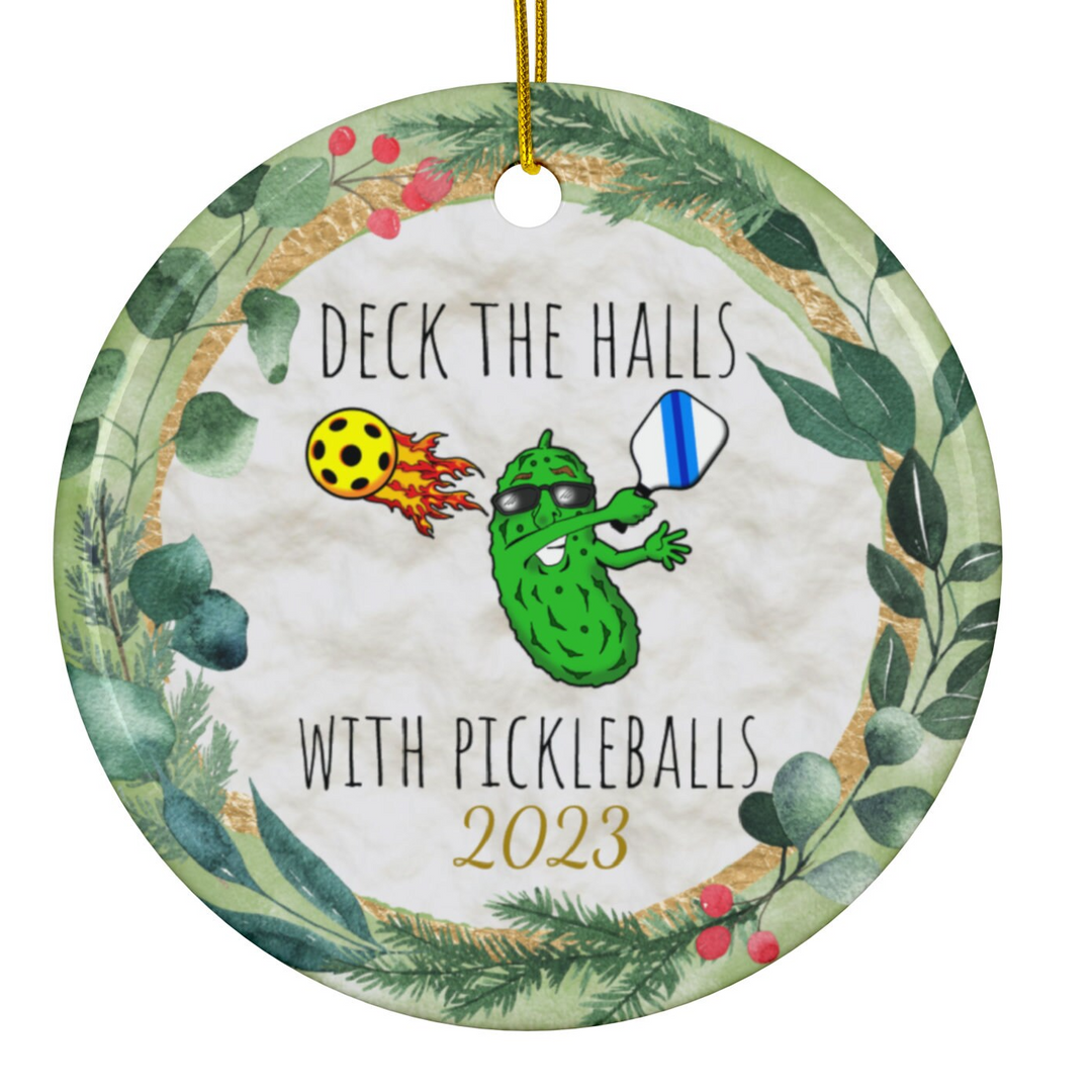 a christmas ornament with a picture of a pickleball and a lady