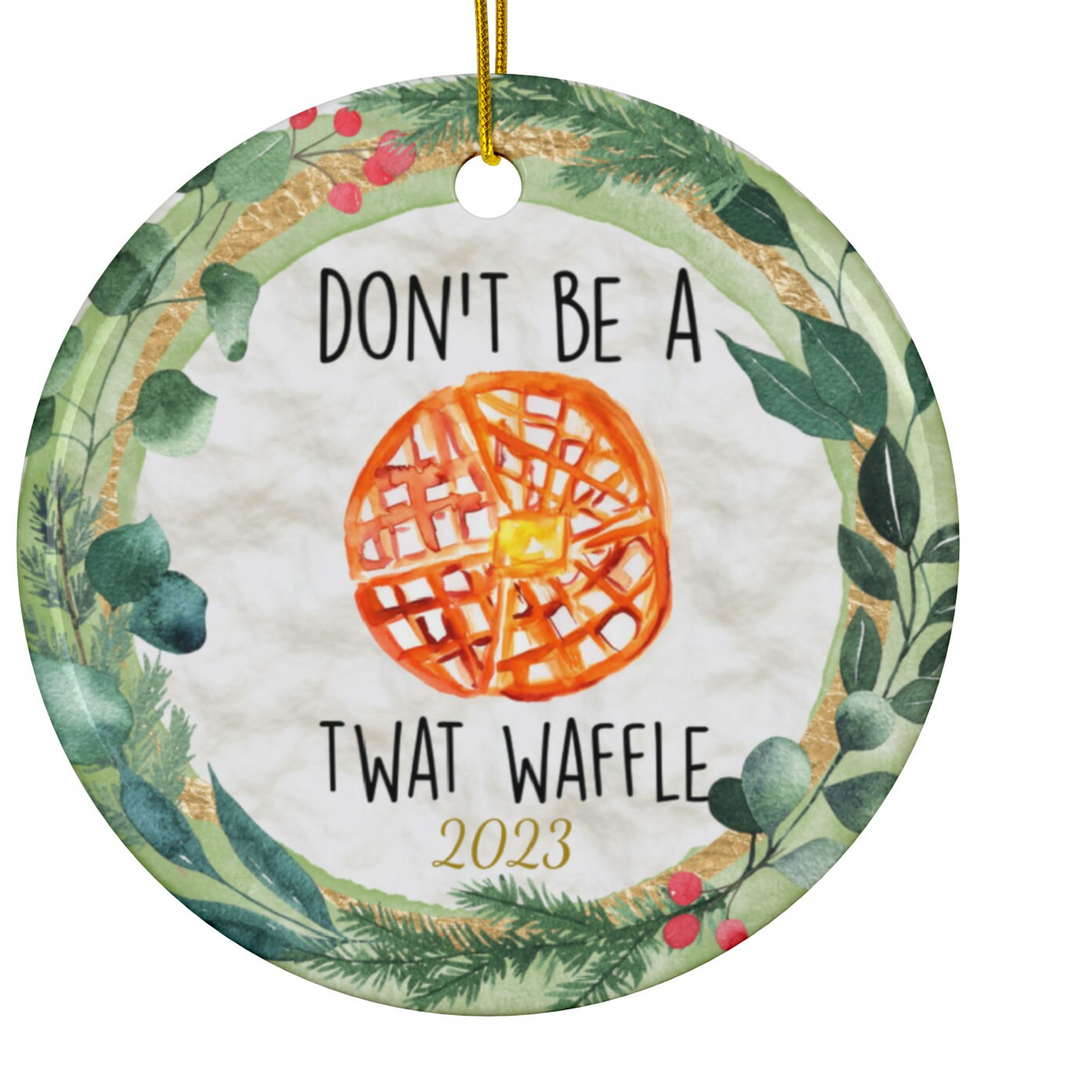 a ceramic ornament that says don't be a twat waffle