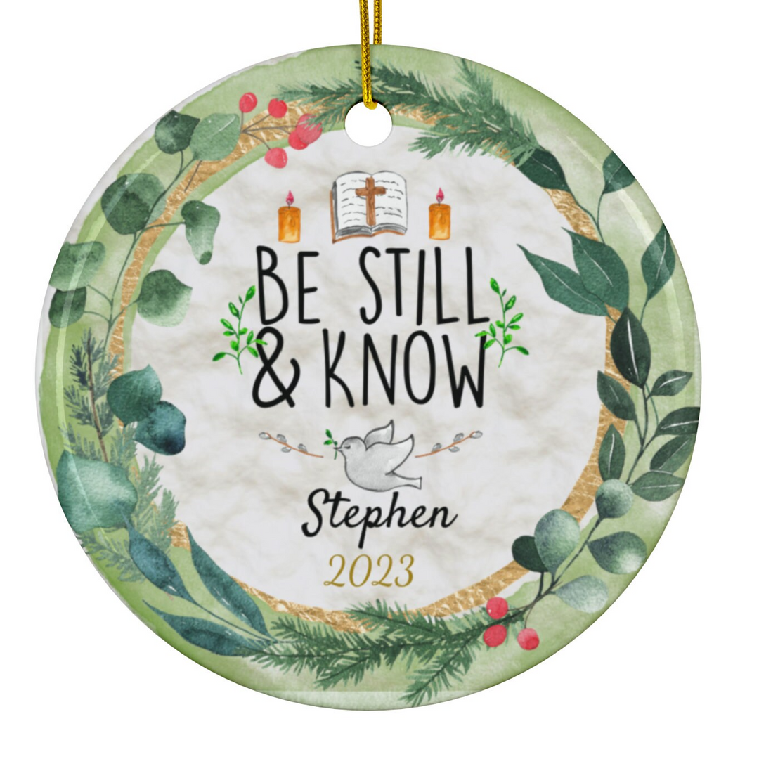 a ceramic ornament with the words be still and know